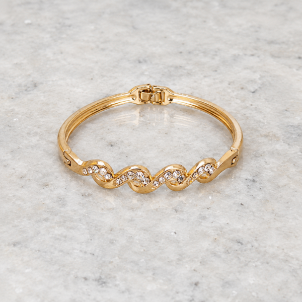 Brazalete Dorado Ondina Brazalete Dorado Ondina con diseño de ondas y brillantes