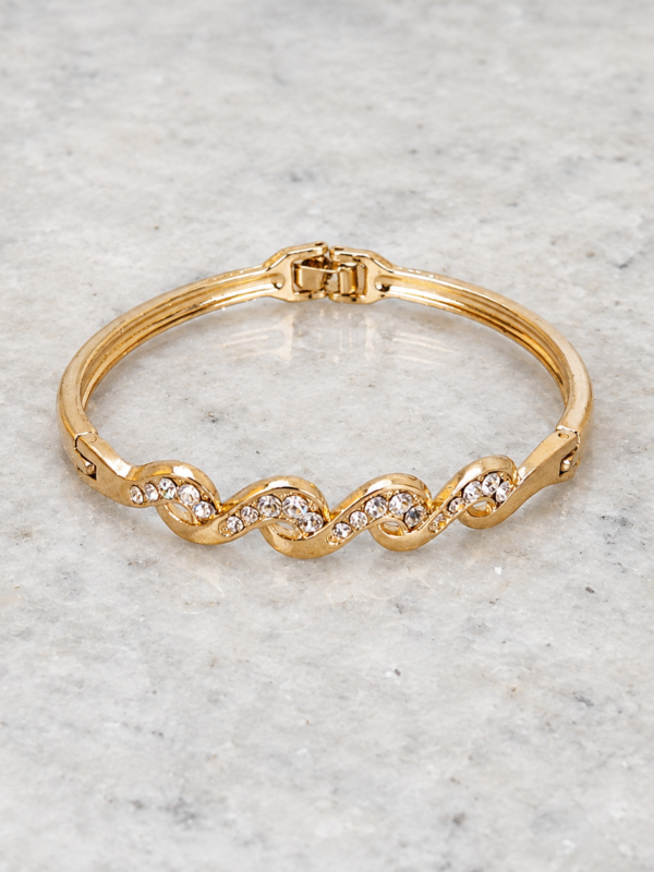Brazalete Dorado Ondina Brazalete Dorado Ondina con diseño de ondas y brillantes