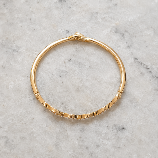 Brazalete Dorado Ondina Brazalete Dorado Ondina con diseño de ondas y brillantes